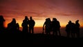 Beautiful shot of the silhouettes of some people during the sunset