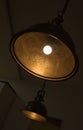 Beautiful shot of a simple ceiling light hanging in a room Royalty Free Stock Photo