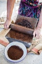 Beautiful shot of the skilled worker grinding Coffee Beans by hand in Guatemala Royalty Free Stock Photo