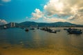 Beautiful shot of small boats in the sea next to the shore on a cloudy day Royalty Free Stock Photo