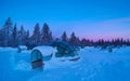 Beautiful shot of snow covering glassy igloos serving as tourist observatories.