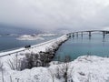 Beautiful shot of the snowy Sommaroy Bridge connecting the islands of Kvaloya and Sommaroy