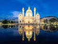 Beautiful shot of St. Charles Church illuminated at night, reflecting in a pond in Vienna, Austria