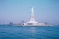 Beautiful shot of the Statue of Liberty from a boat in the ocean in New York City Royalty Free Stock Photo