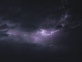 Beautiful shot of striking lightning in a dark purple sky Royalty Free Stock Photo