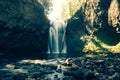 Beautiful shot of a strong waterfall falling in the river in the middle of a forest Royalty Free Stock Photo