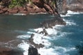 Beautiful shot of strong waves hitting the rocky shore of the Haleakala National Park