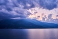 Beautiful shot of a sunset sky over Lake Como and nearby mountains Royalty Free Stock Photo