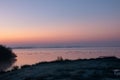 Beautiful shot of a sunset sky over the sea with flying birds Royalty Free Stock Photo