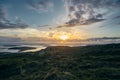 Beautiful shot of a sunset from Sky Road, Clifden in Ireland with green fields and ocean Royalty Free Stock Photo