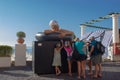 Beautiful shot of the Survival of Serena statue with some tourists near in Capri, Italy