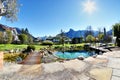 Beautiful shot of a swimming pool in the backyard of a luxury house Royalty Free Stock Photo