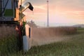 Beautiful shot of a tractor reaping the wheat fields Royalty Free Stock Photo