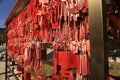 Beautiful shot of traditional Chinese wishes hanging on a metallic construction