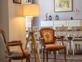 Beautiful shot of a vintage style interior of a dining room with antique chairs