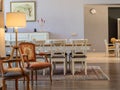 Beautiful shot of a vintage style interior of a dining room with antique chairs