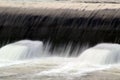 Beautiful shot of the water falling over the dam Royalty Free Stock Photo