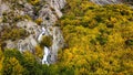 Beautiful shot of a waterfall falling from the rocks with a forest around in Troyan in Bulgaria