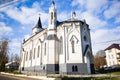 Beautiful shot of white old church with crosses on domes against a blue cloudy sky on sunny day Royalty Free Stock Photo