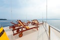 Beautiful shot from the yacht of four lounge chairs on the top Royalty Free Stock Photo