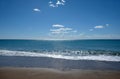 Beautiful sieside landscape with calm sea surf with waves and sun reflecton on water on skyline Royalty Free Stock Photo