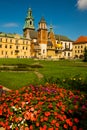 Beautiful sightseeing with Wawel Royal Castle and colorful flowers in Krakow, Poland