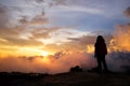 Beautiful silhouette of asian woman with Destination and paradise of golden sunrise and sunset shining to the mist and fog in the Royalty Free Stock Photo