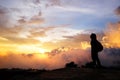 Beautiful silhouette of asian woman with Destination and paradise of golden sunrise and sunset shining to the mist and fog in the Royalty Free Stock Photo