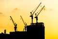 Beautiful Silhouette crane under construction building