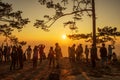 Beautiful Silhouette of hiker enjoy mist and sunrise at Nok Aen Cliff, Phu of Kradueng national park, Loei, Thailand