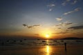 Beautiful silhouette of people, ship and long tail boat on sea or ocean with blue sky and cloud at sunset, sunrise or twilight