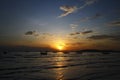 Beautiful silhouette of ship and long tail boat on sea or ocean with blue sky and cloud at sunset, sunrise or twilight time Royalty Free Stock Photo