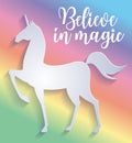 Beautiful silhouette of unicorn in paper cut style. Colorful rainbow background. Typography poster. Believe in magic