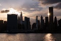 Beautiful Silhouettes of Skyscrapers in the Midtown Manhattan Skyline during a Sunset along the East River in New York City Royalty Free Stock Photo