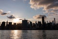 Beautiful Silhouettes of Skyscrapers in the Midtown Manhattan Skyline during a Sunset over the East River in New York City Royalty Free Stock Photo