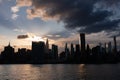 Beautiful Silhouettes of Skyscrapers in the Midtown Manhattan Skyline during a Sunset over the East River in New York City Royalty Free Stock Photo