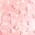 Beautiful silk pink hearts on a pink background. Holiday concept Valentine`s Day. Flat lay. Royalty Free Stock Photo