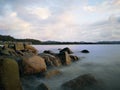 Sunset view with silky smooth water reflection on the sea shore landscape with beautiful sunset view. Royalty Free Stock Photo