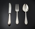 Beautiful silver cutlery on black background Royalty Free Stock Photo