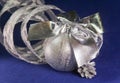 Beautiful silvery New Year`s ball, brilliant tinsel aon a blue background - New Year`s composition, a card