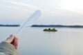 Feather, feather of a bird on the background of sunset Royalty Free Stock Photo