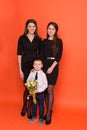 Beautiful sister with brother with a bouquet of flowers