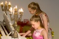 Portrait of Beautiful Teenage Girls Playing Piano Together. Royalty Free Stock Photo