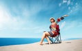 Beautiful sitting woman enjoying the idyllic scene of the sun, sand and sea. Beautyful sandy Patara beach in Antalya. Royalty Free Stock Photo