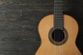 Beautiful six - string classic guitar on wooden background Royalty Free Stock Photo