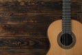 Beautiful six - string classic guitar on wooden background Royalty Free Stock Photo