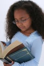 Beautiful Six Year Old In Glasses Readign Large Book Royalty Free Stock Photo