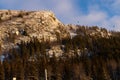 Beautiful ski slope in Funasdalen, Sweden with ski lift, gondola going up the hill surrounded by forest on a sunny winter day. Royalty Free Stock Photo