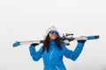 beautiful Skier woman smiling on top of the mountain. Fog. Winter season. Sports concept