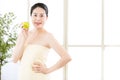 Beautiful skin asian woman towel wrap holding fresh apple Royalty Free Stock Photo